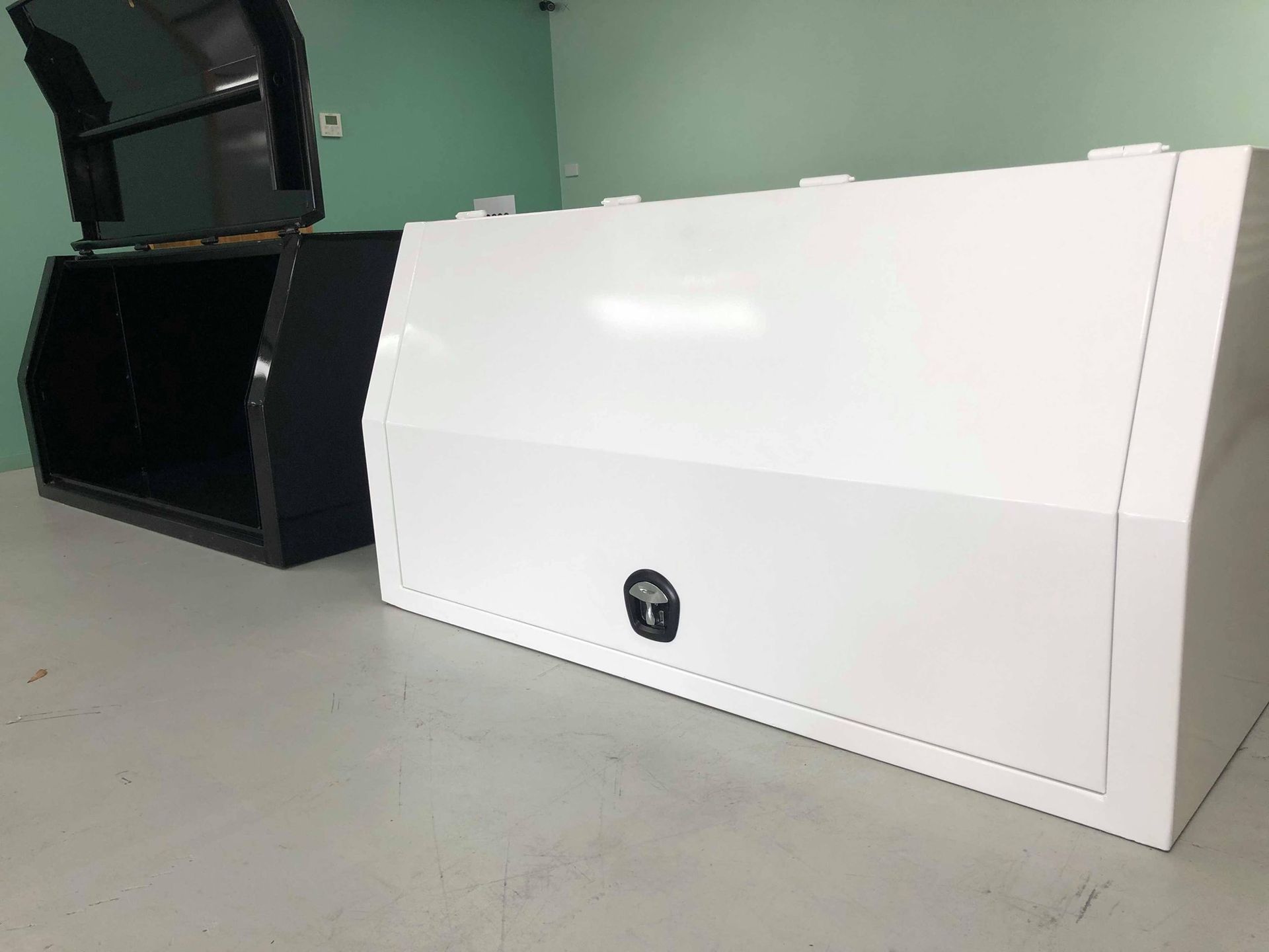 White and Black Truck Toolboxes Displayed On a Floor — PT Canopy In Slacks Creek, QLD