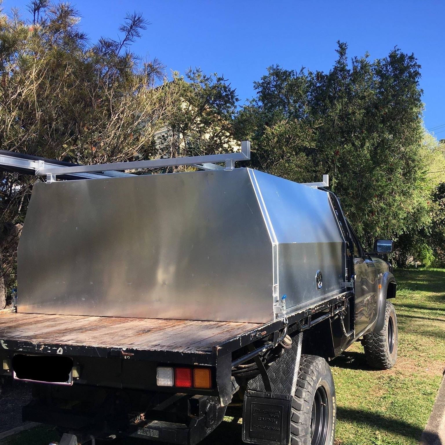 A Flatbed Utility Truck With a Large, Silver Metal Canopy and a Roof Rack — PT Canopy In Slacks Creek, QLD