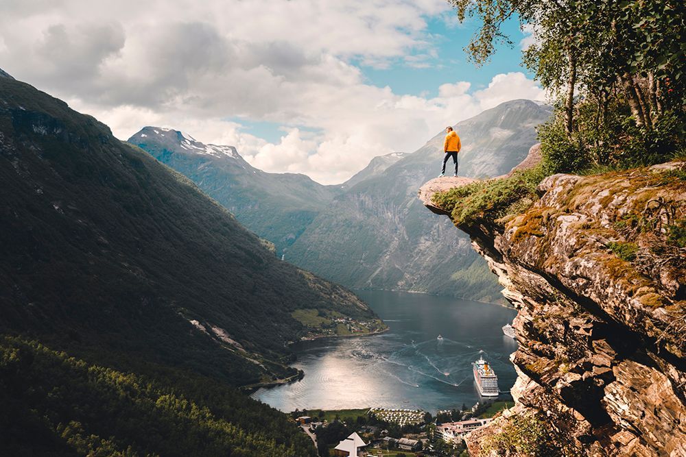 One Person Standing on Top of a Cliff | Peoria, IL | Alexander Travel