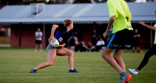 women playing rugby