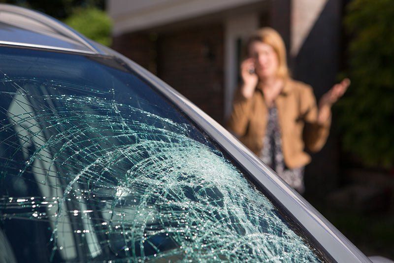 Automotive Glass Repair — Woman Calling for Help in Louisville, KY