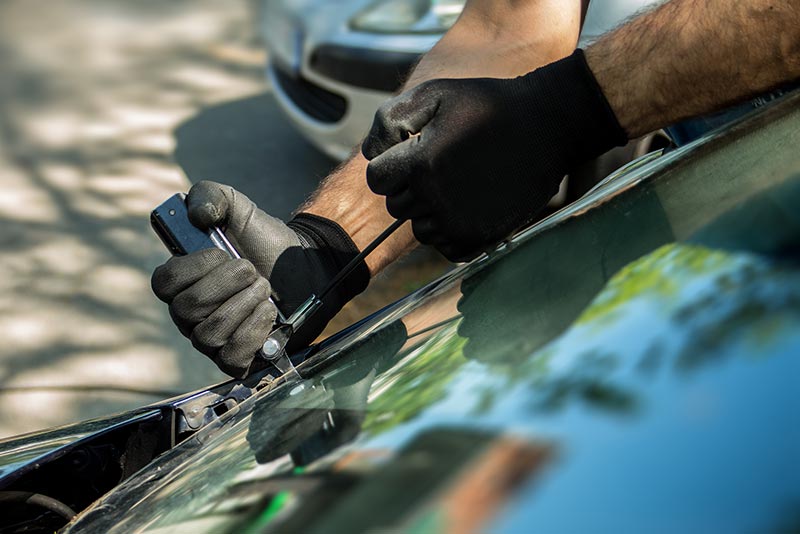 Auto Glass Replacement — Man Installing New Windshield in Louisville, KY