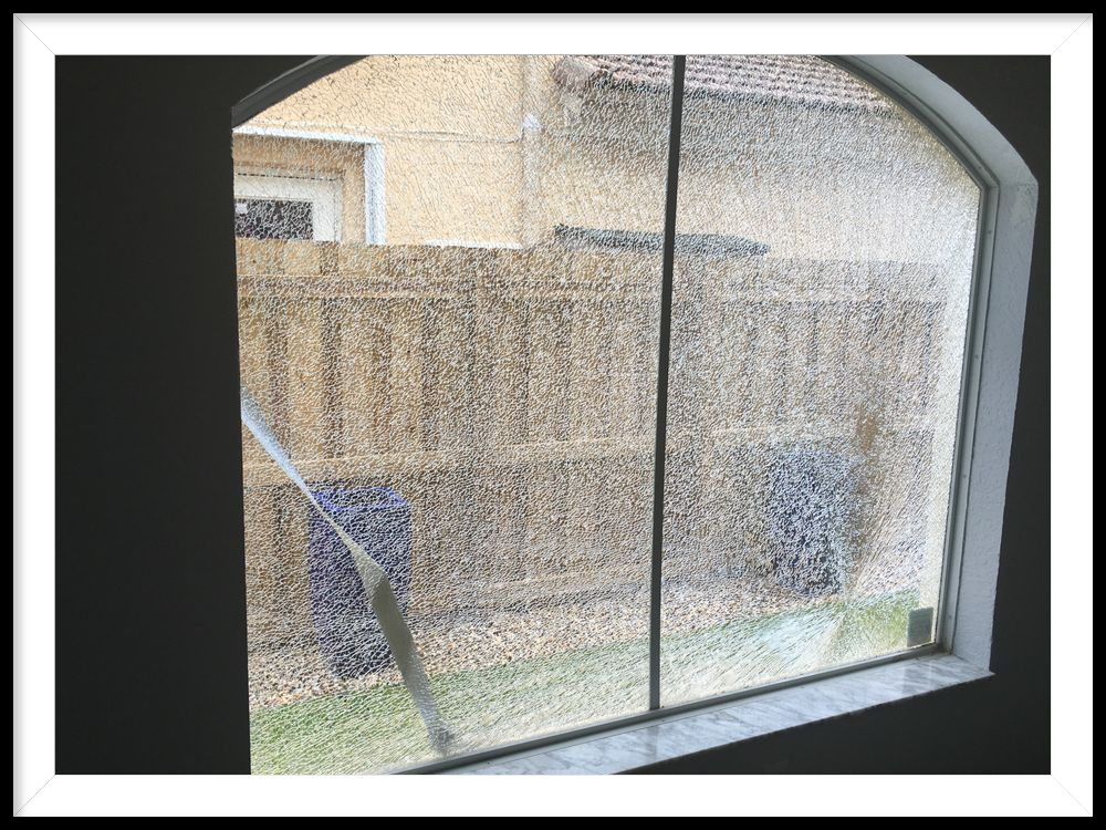 Broken Window Repair — Man Installing Glass Windows in a House in Louisville, KY