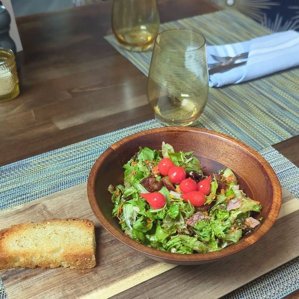 Salad in wooden bowl