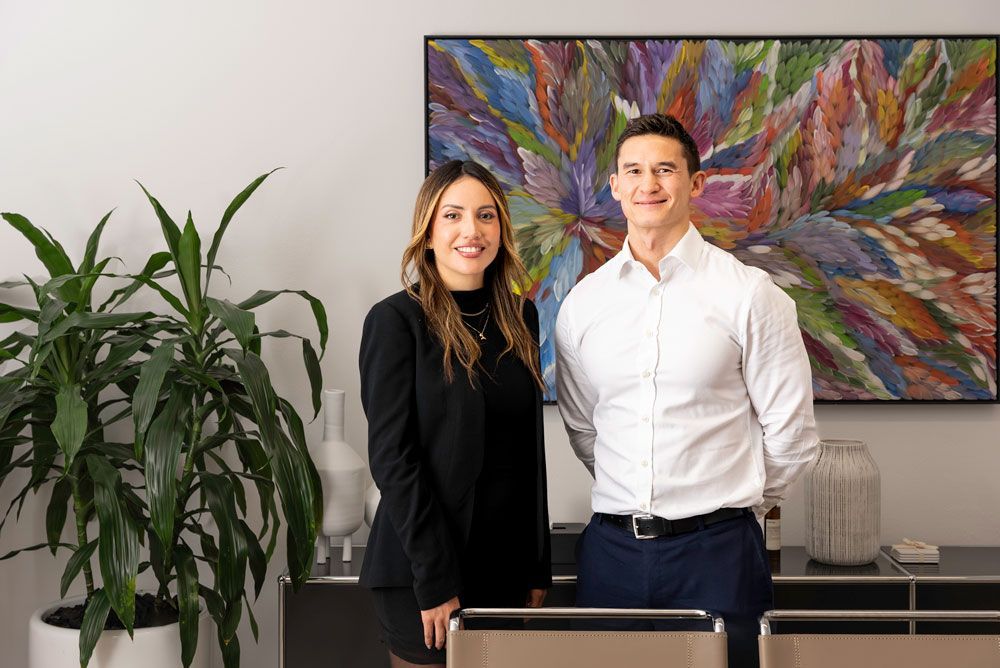An expert finance & treasury recruiter in a suit is smiling