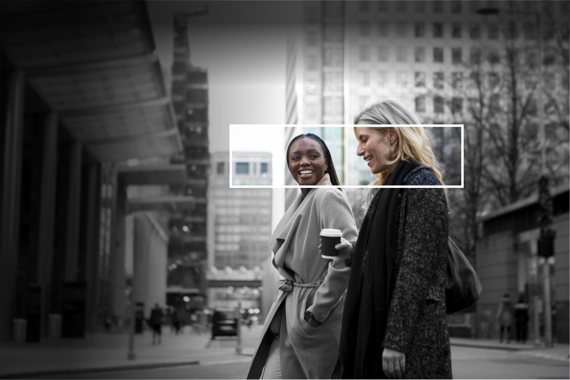 A black and white photo of two professional candidates walking down a city street.