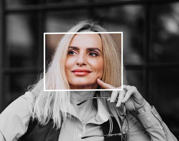 A product & design recruitment specialist smiling looking sideways