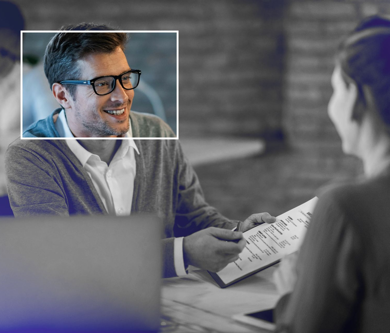 Lanson Partners team posing for a picture while sitting at a table