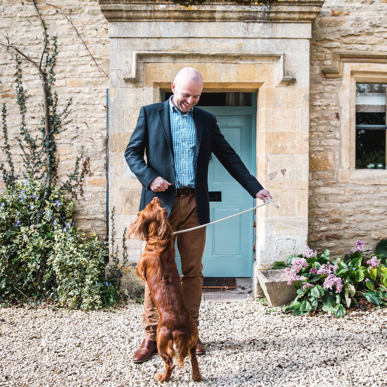 Edward from Cotswold Tiger, The Second Home Company with red spaniel on lead