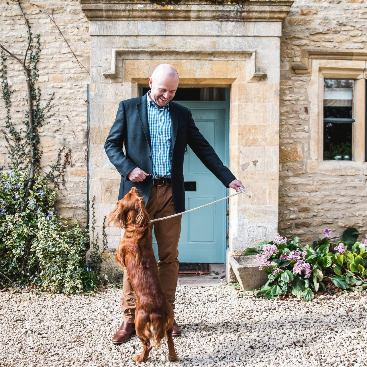 Edward from Cotswold Tiger, The Second Home Company with red spaniel on lead