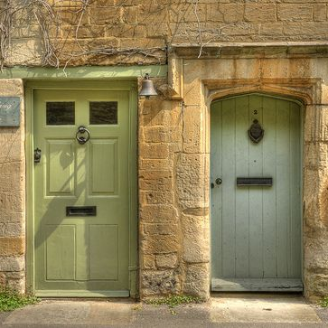 two green front doors on cotswold stone houses, Cotswold Tiger, The Second Home Company