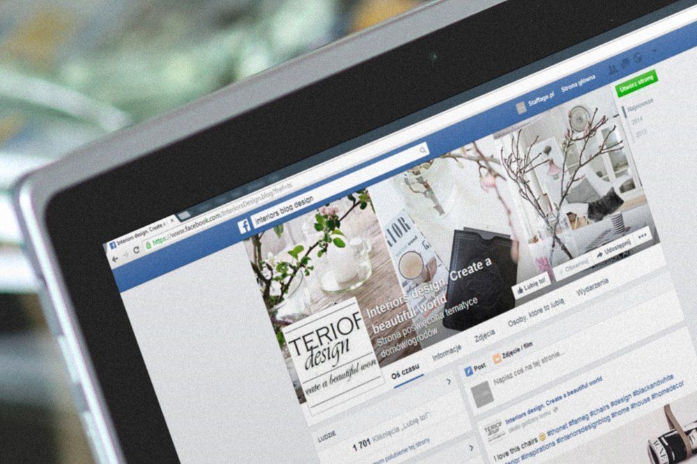 A laptop is open to a facebook page