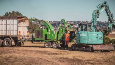 Man Operating Wood Chipper — Central West NSW — OS Trees