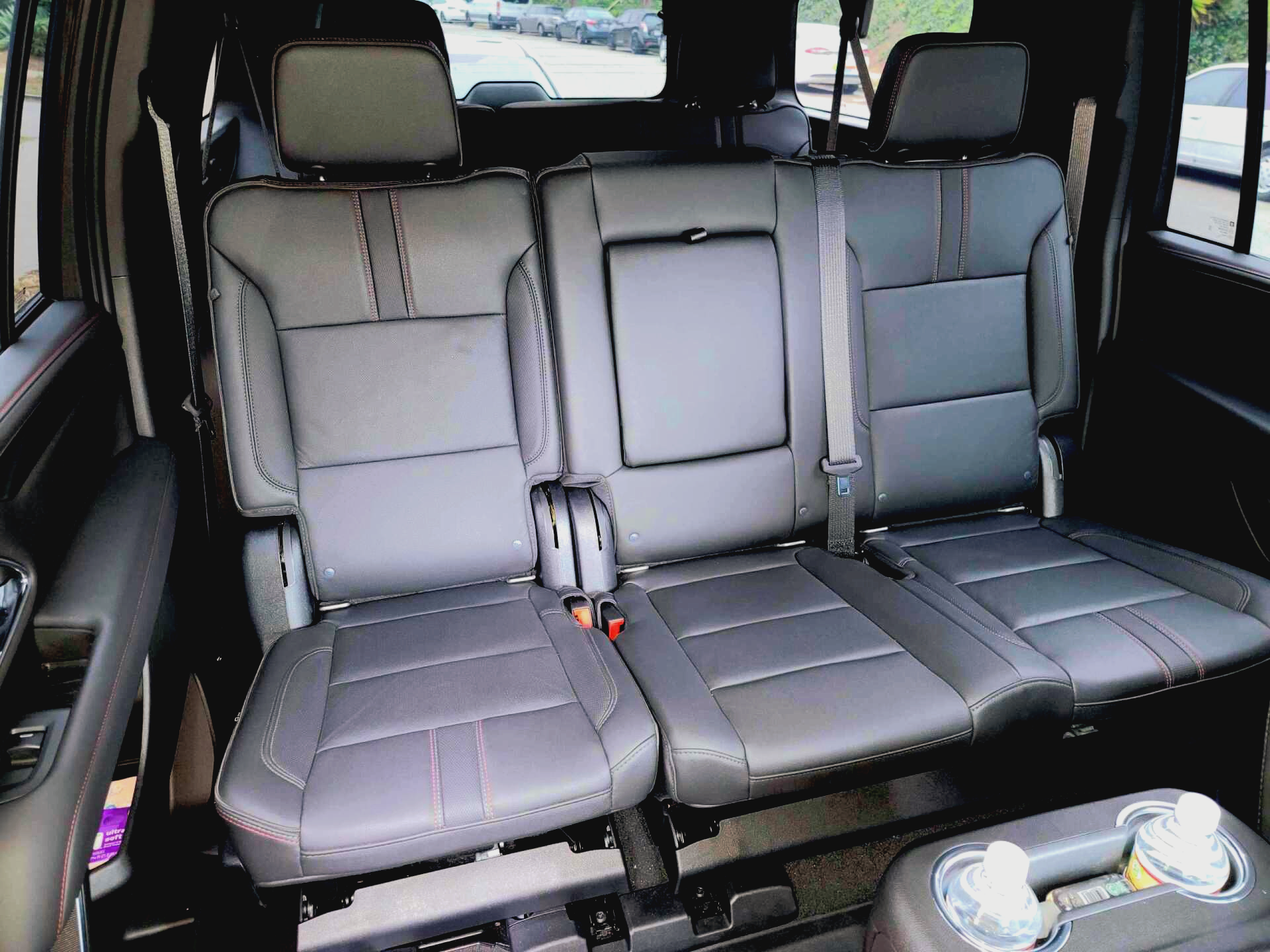 the back seat of a car with three seats folded down .