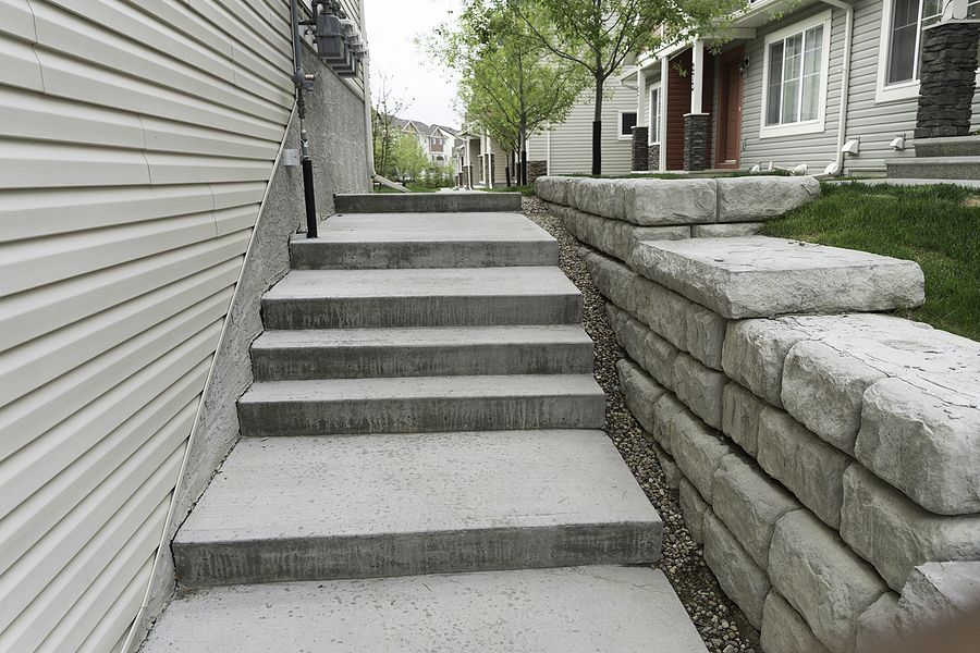 concrete steps leading up to a house in a neighborhood