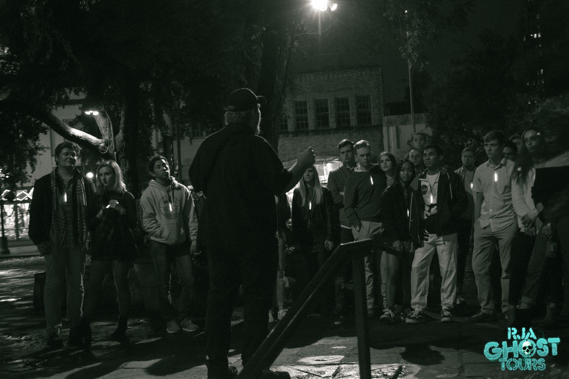 Tour guide standing in front guests on our San Antonio Ghost Tour. 