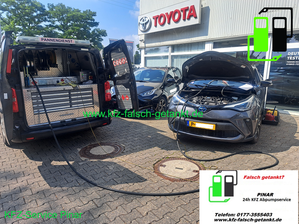 A van refueling a Toyota car outside a Toyota dealership.