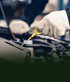 Technician performing Oil Change Service | Two Rivers Auto Tech