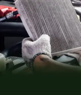 Technician performing Preventative Maintenance Service | Two Rivers Auto Tech