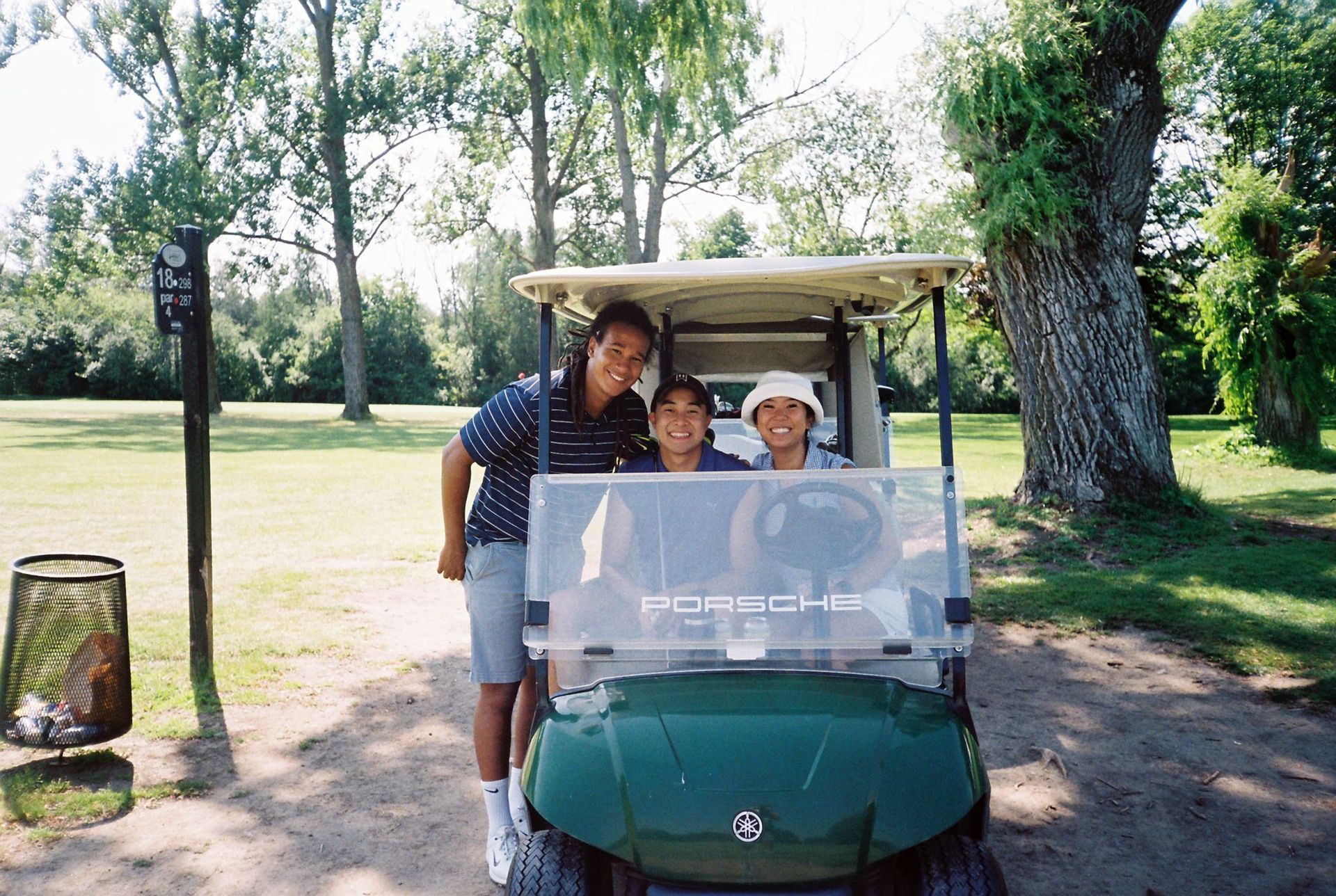 Jonathan, Hunter, and Liz golfing