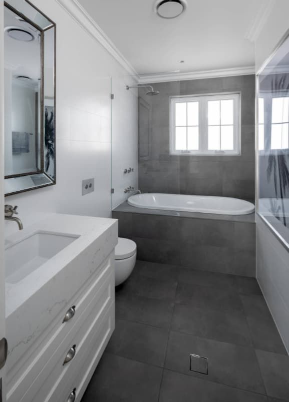 A Bathroom With A Sink, Toilet, Tub And Mirror — Hutchisons Tile Centre In Murwillumbah, NSW