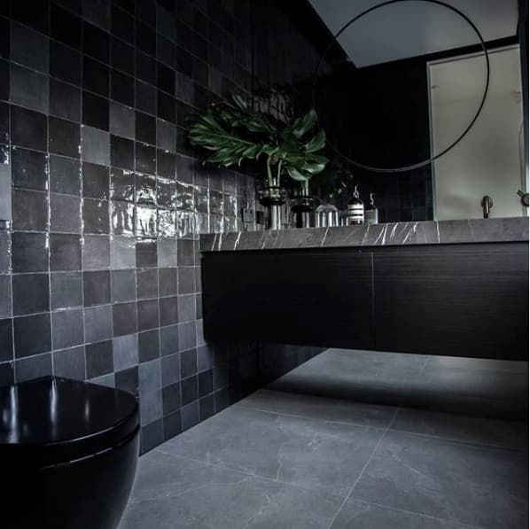 A Bathroom With Black Tiles And A Black Toilet — Hutchisons Tile Centre In Tweed Heads, NSW