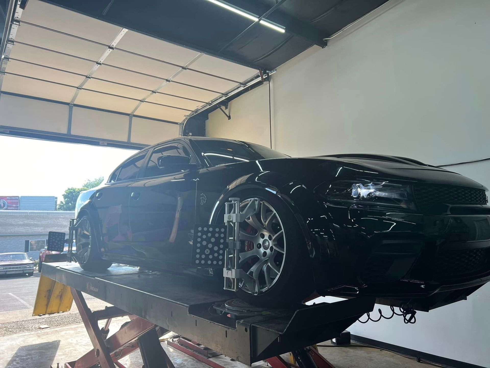 Black Car for Wheel Alignment | TNT Automotive