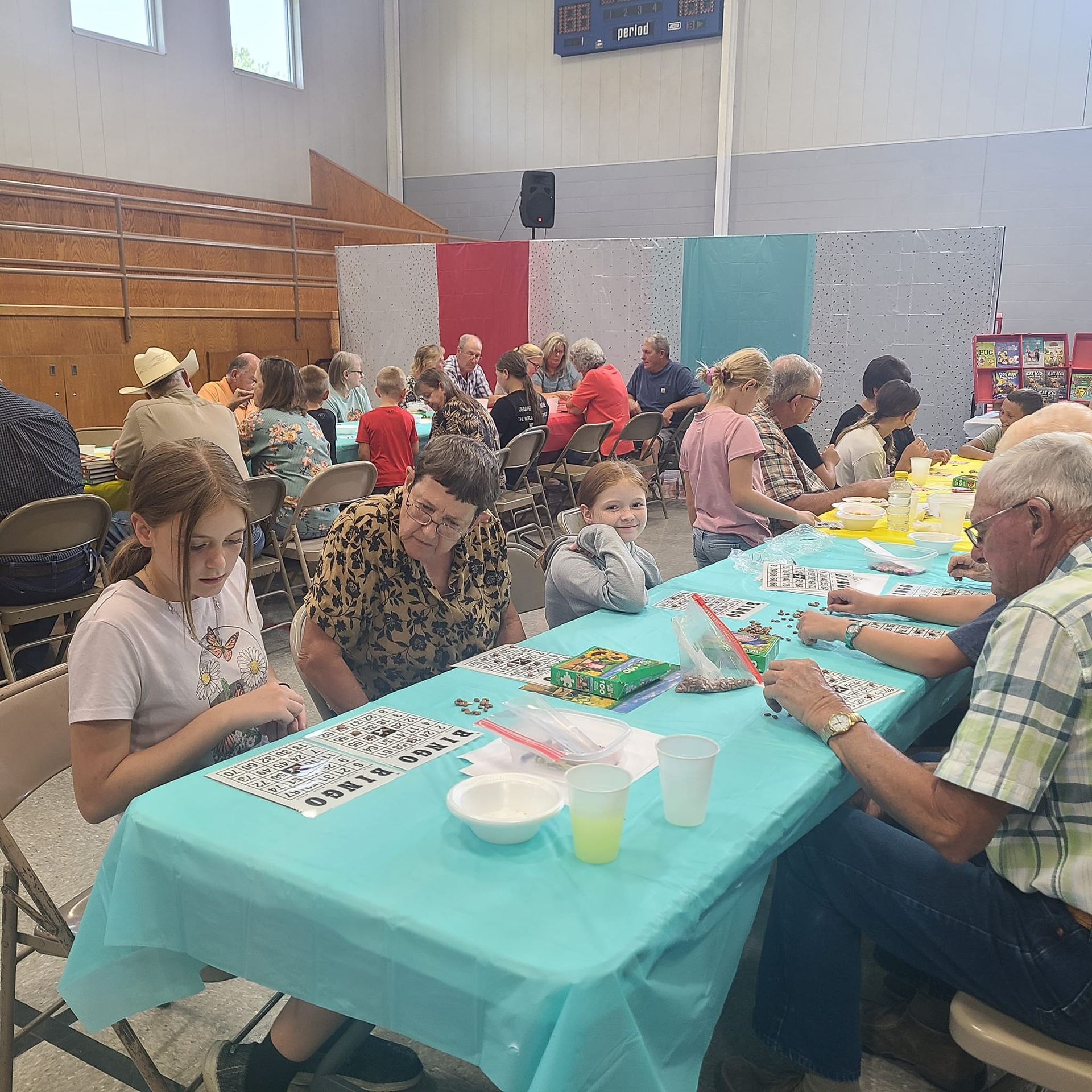 Students and their grandparents playing BINGO during Grandparent's Day.