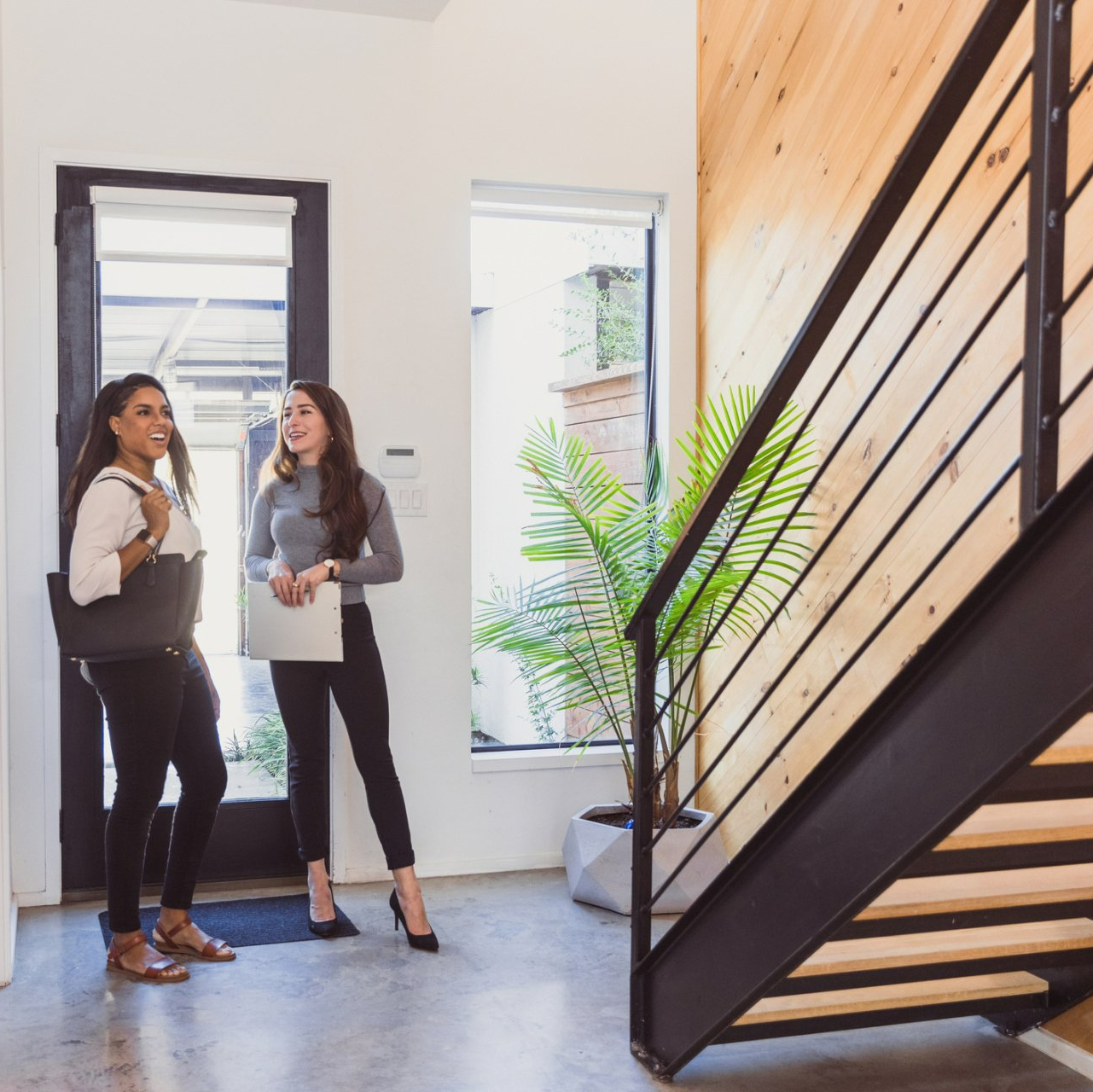 A Real Estate Agent Assisting A Client — Saint Louis, MO — Urban City Wide Development & Joint Venture Group