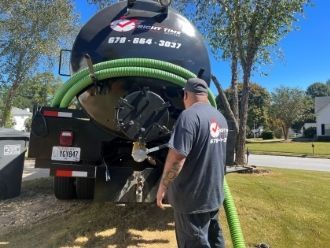 hooking up hose to septic truck