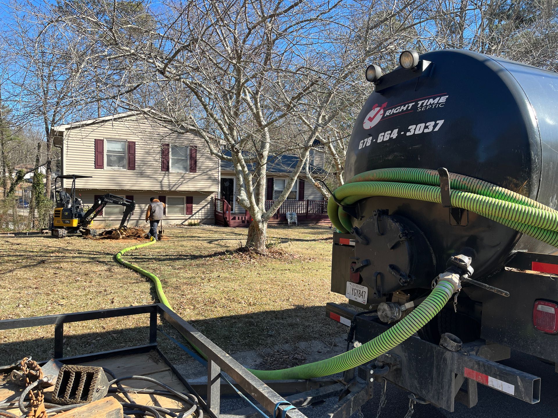 pumping a septic tank from the street with hose in winder ga