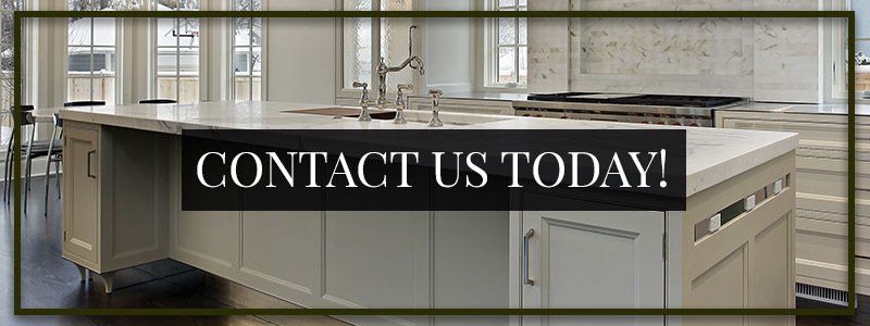 A kitchen with a large island and a sign that says `` contact us today ''.
