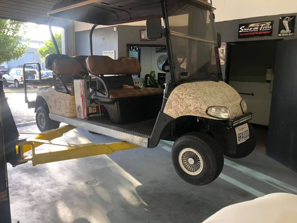 A Golf Cart on a Lift | Niko's Automotive Repair