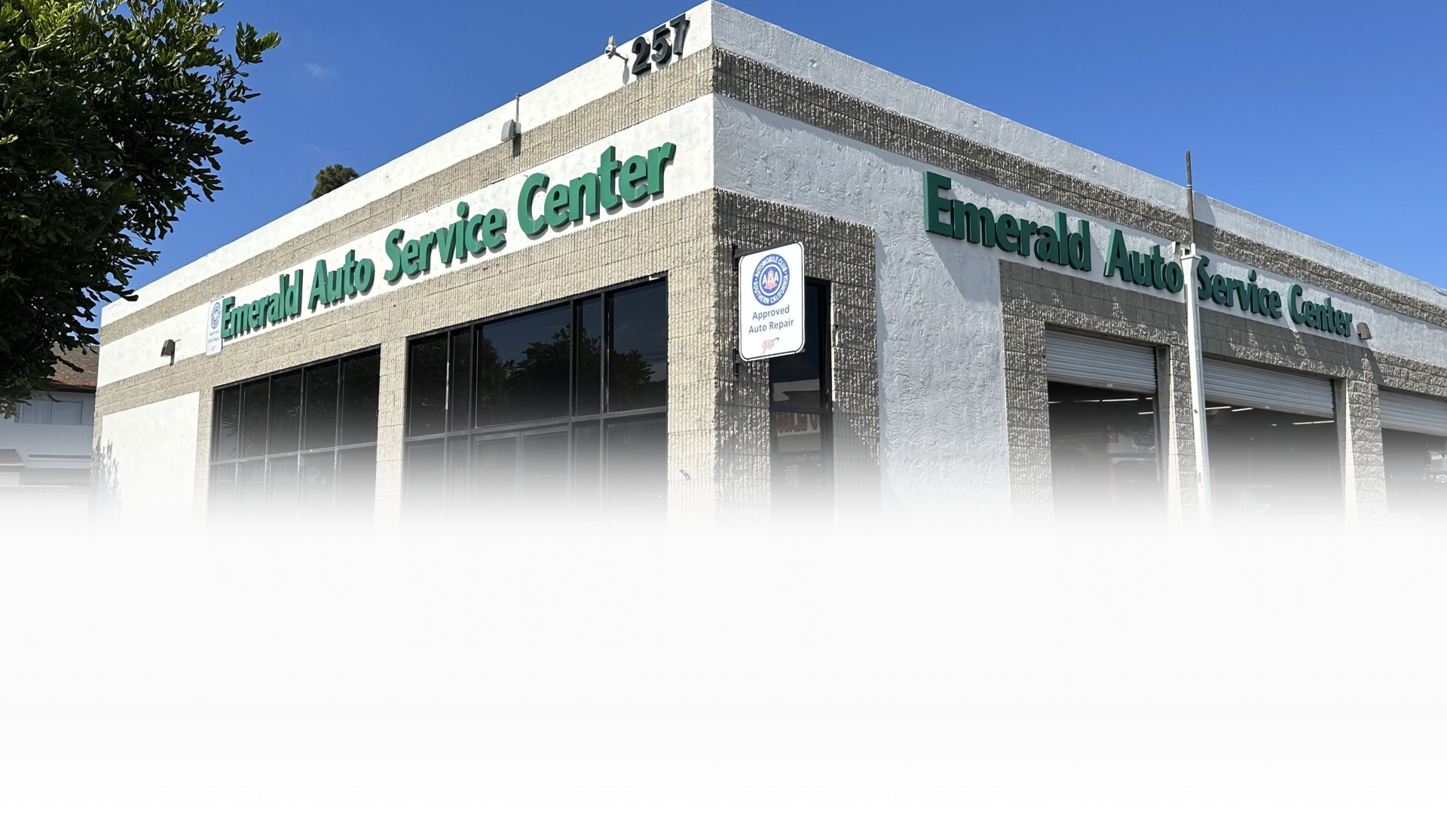 shop bay with cars on lift | Niko's Automotive Repair