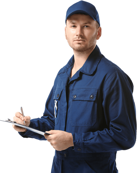 Mechanic holding a tire and wrench, smiling. Wearing blue coveralls and white gloves.