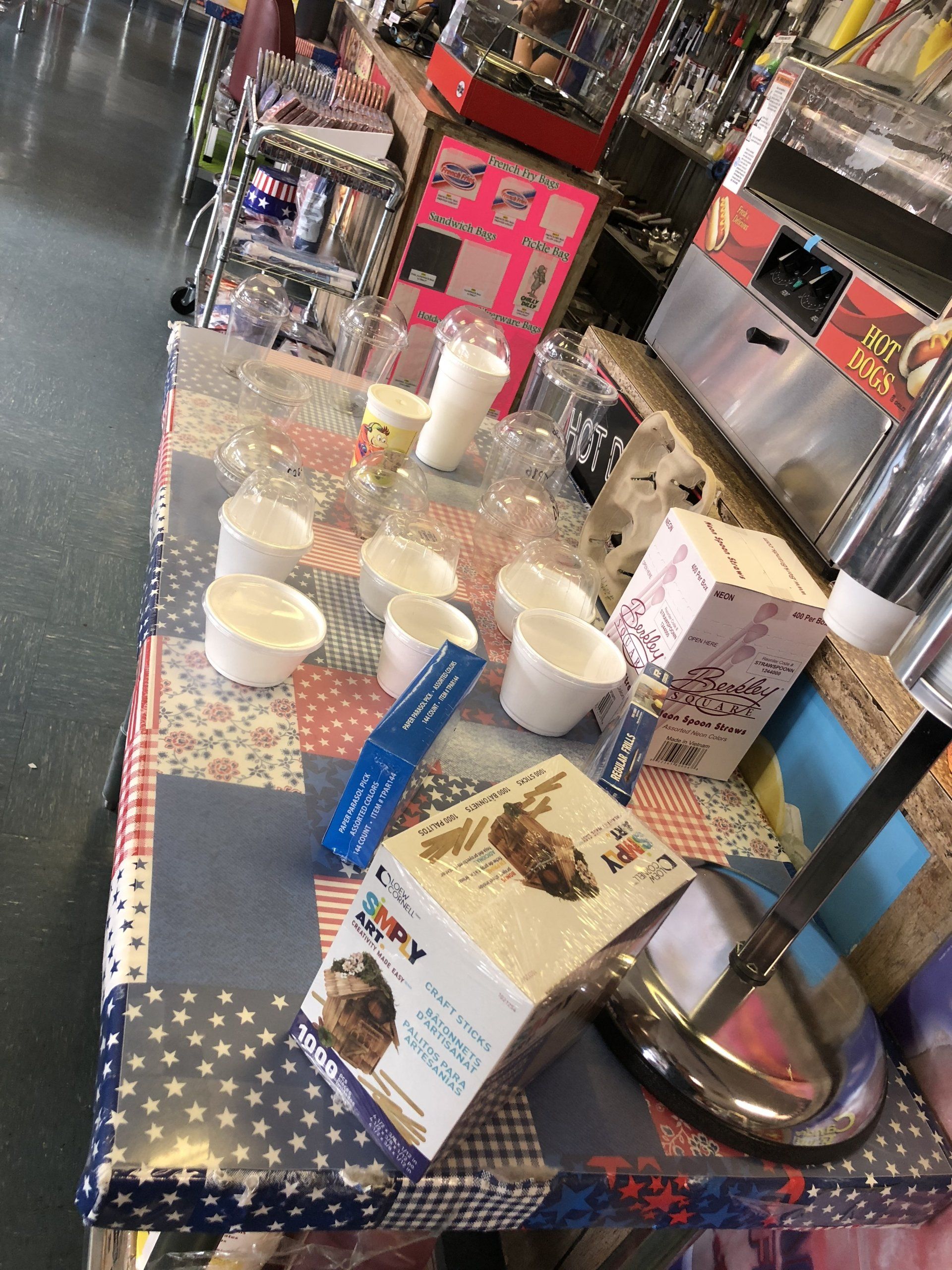 A table with cups and a box that says happy on it