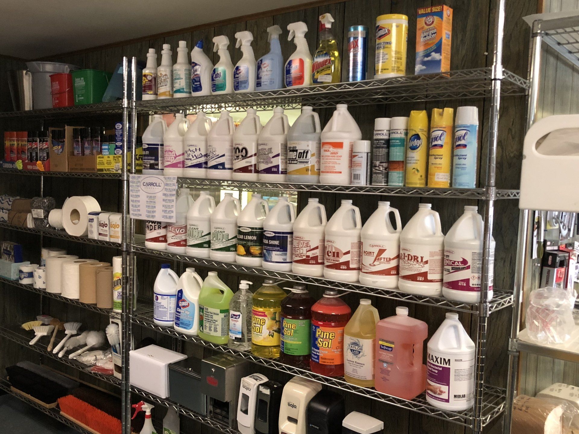 A store shelf filled with lots of cleaning supplies
