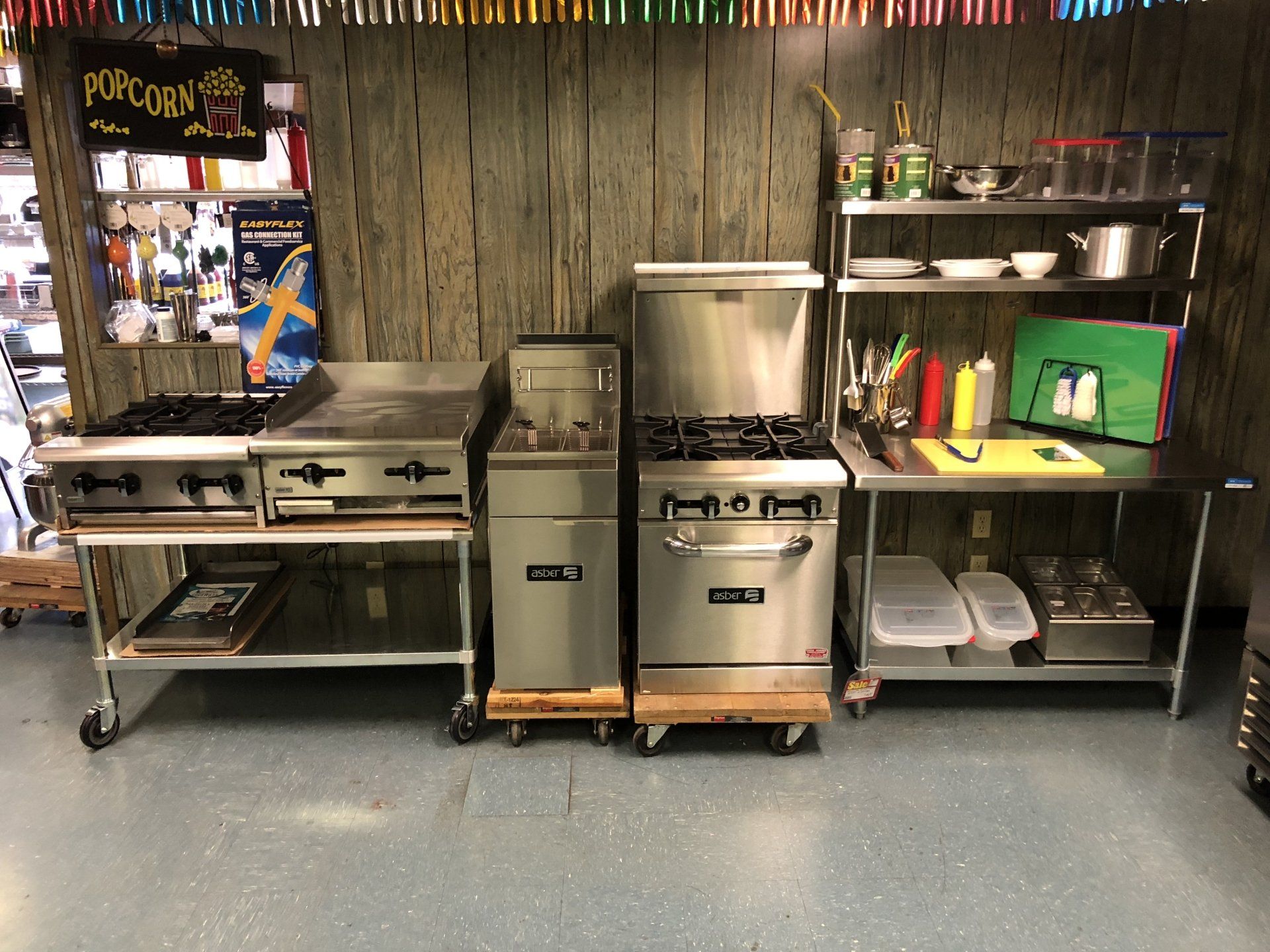 A kitchen with a sign that says popcorn on it