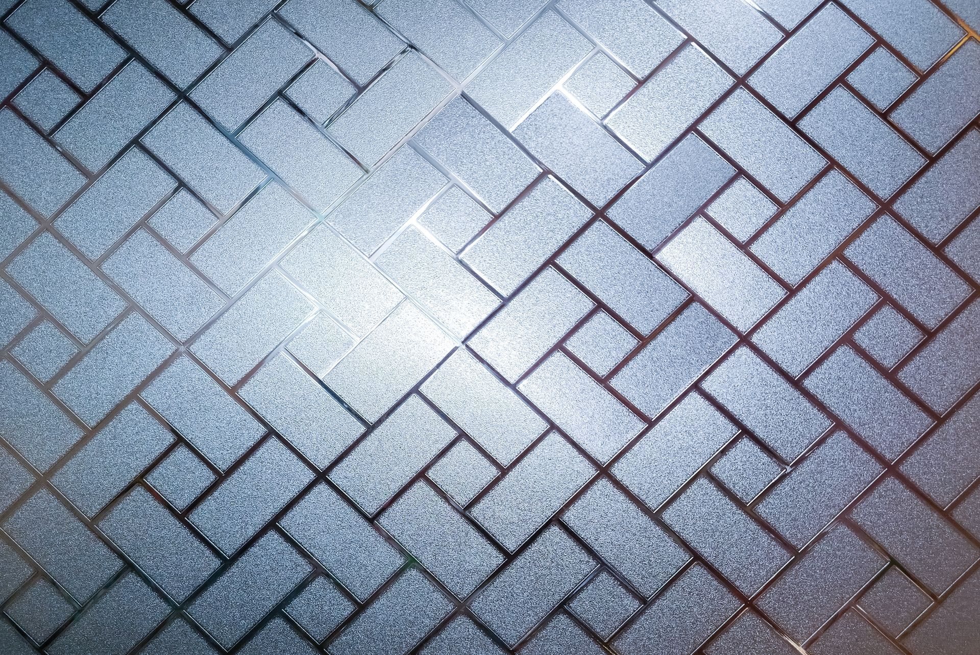 Frosted glass panel with repeating brick pattern, in shades of blue.