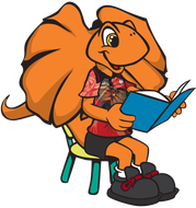 Orange cartoon lizard writing on paper; wearing shirt, shorts, and shoes.