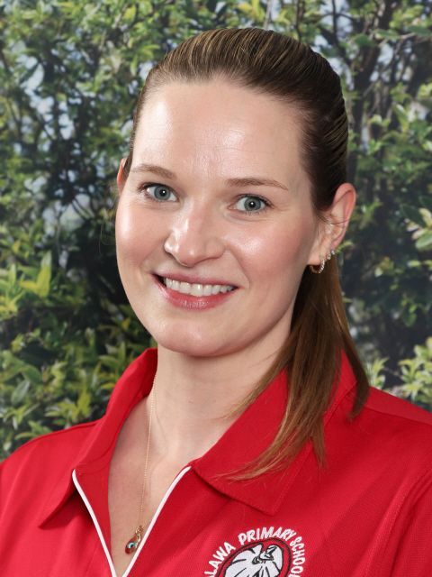 Woman wearing a red collared shirt with 