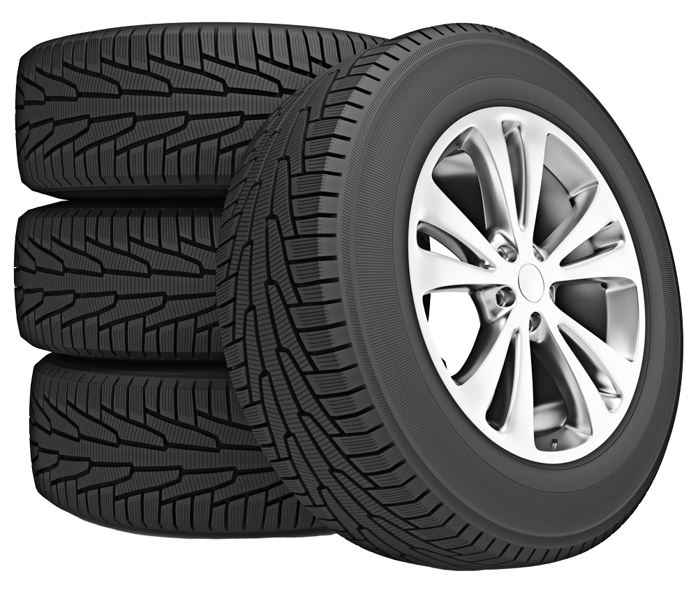 Four winter tires, three stacked, one mounted on a silver alloy wheel.