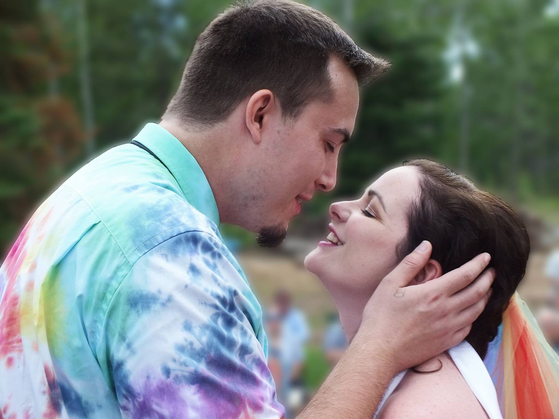 A man and a woman are looking into each other 's eyes.