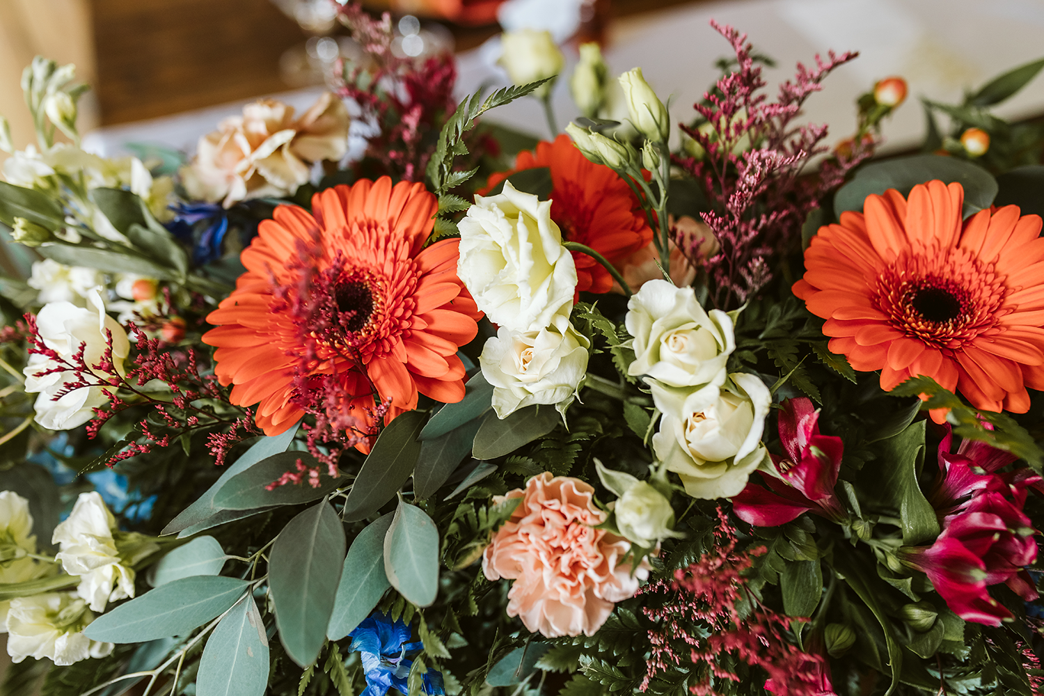 A bunch of flowers are sitting on a table.