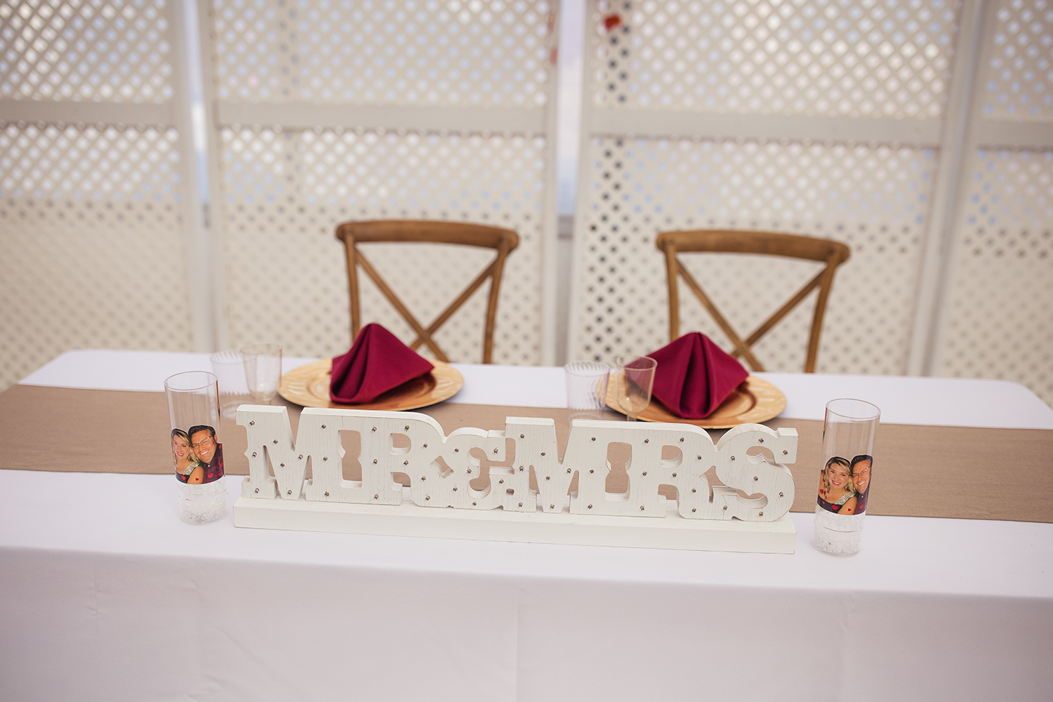 A table with a sign that says mr. and mrs. on it.