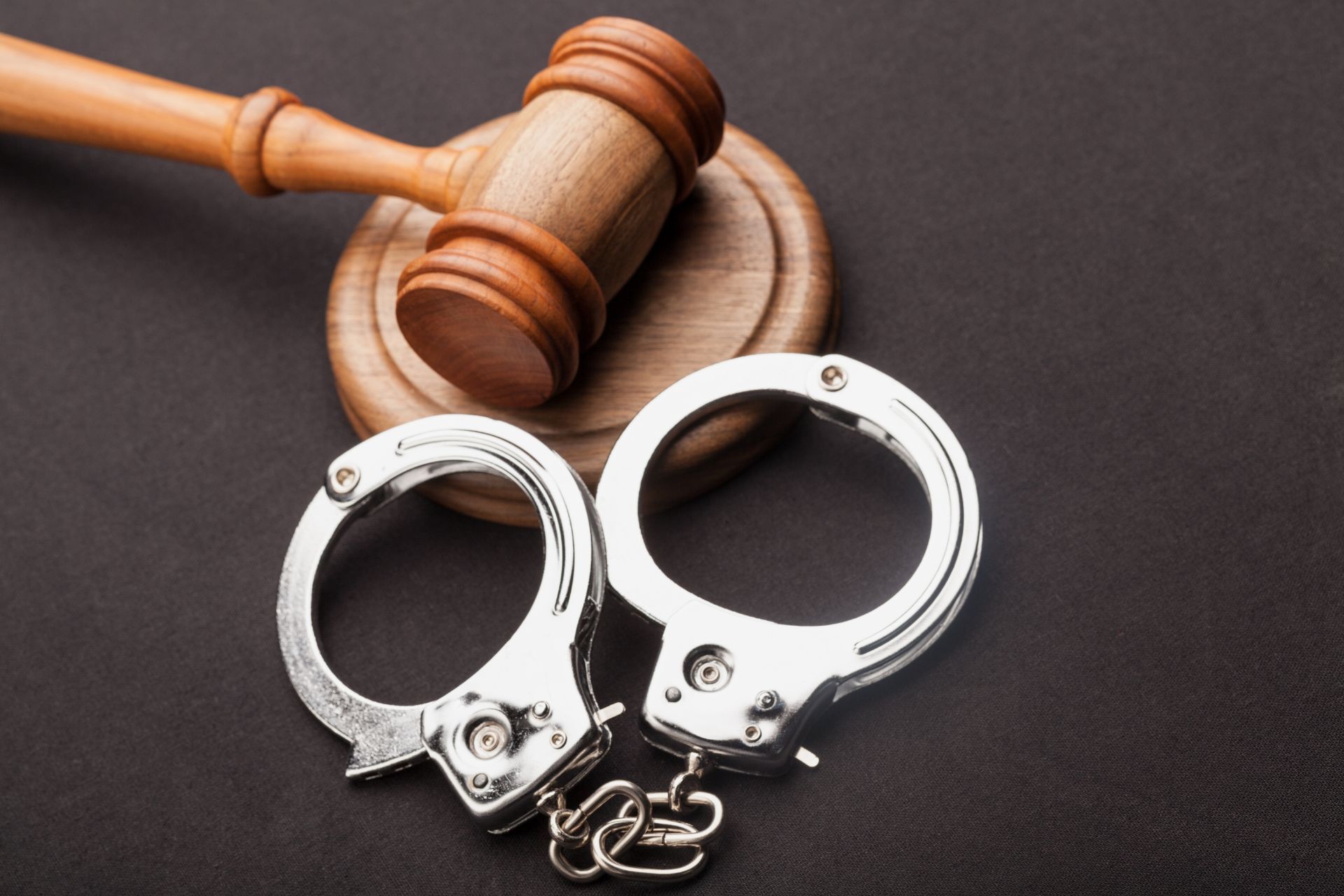handcuffs and judge gavel