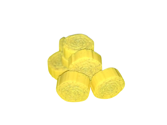 A bunch of yellow pieces of hay are stacked on top of each other on a white background