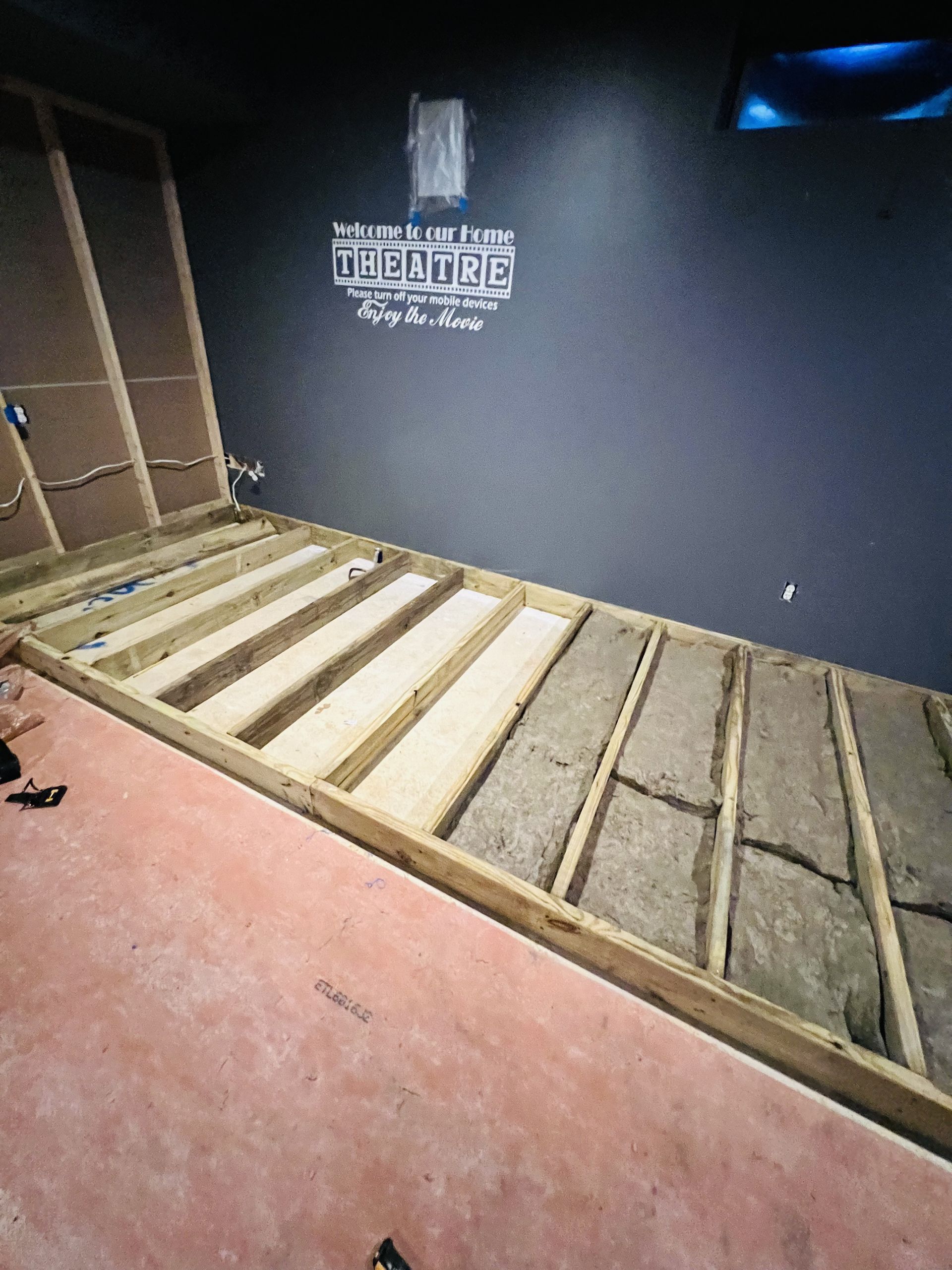 A wooden floor is being built in a room.