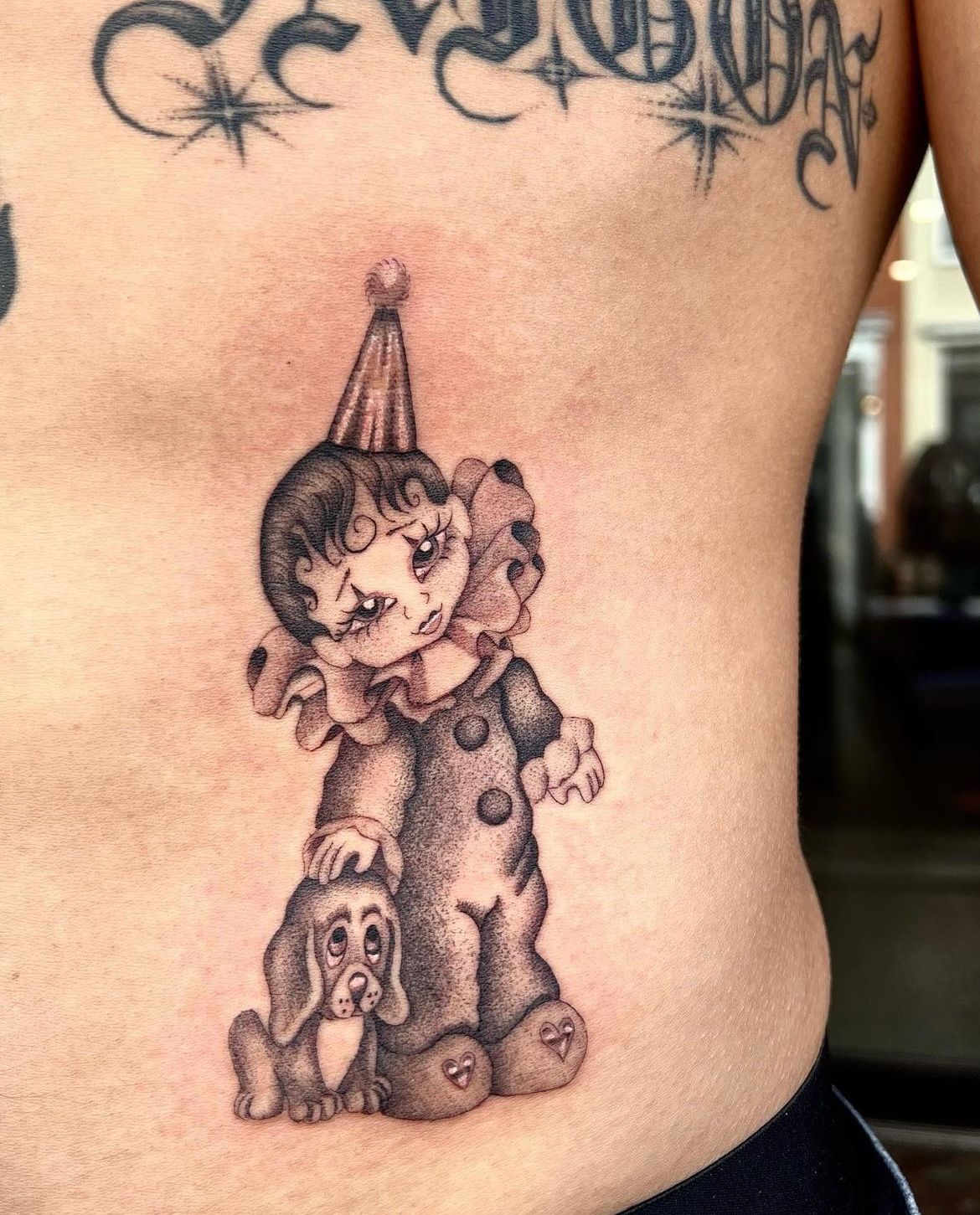 clown tattoo on stomach