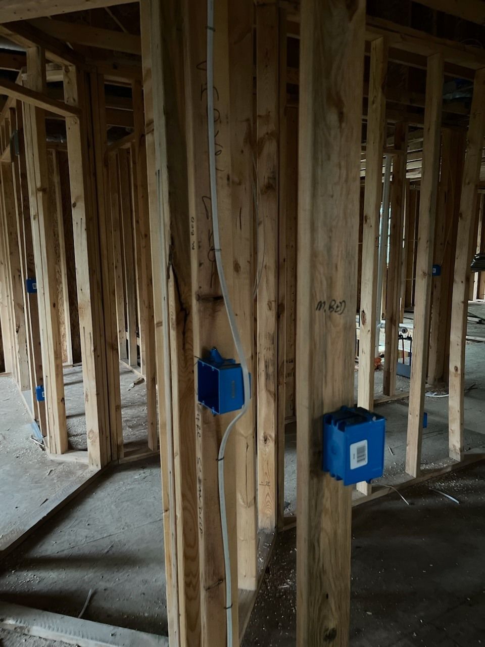 A room with a lot of wooden beams and blue boxes.